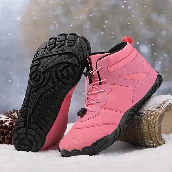 Roze waterdichte dameslaarzen met antislipzool en ergonomisch design, ideaal voor regenachtige en koude dagen.