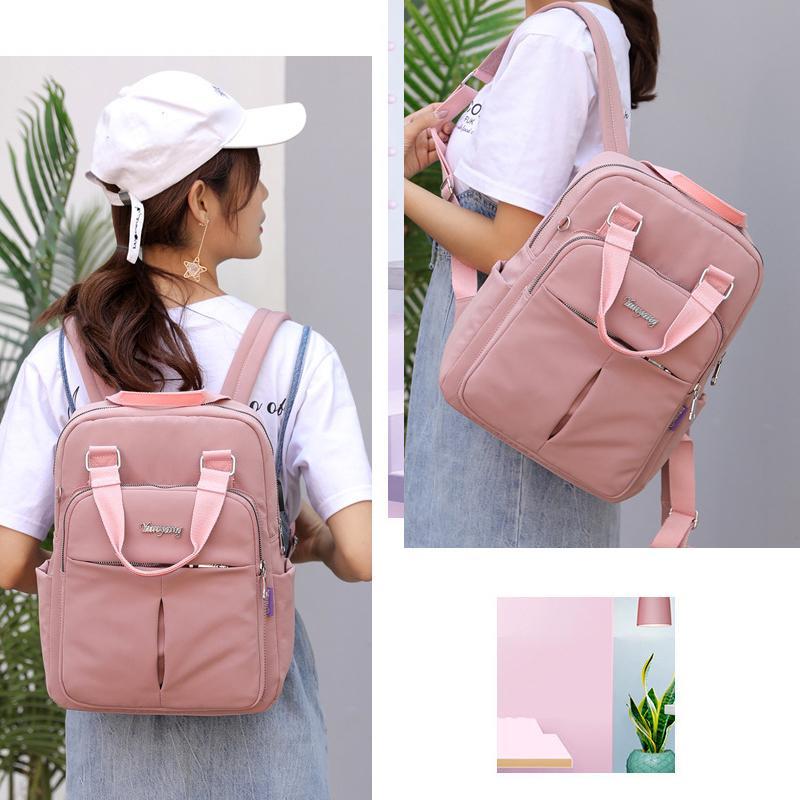 Waterdichte rugzak met USB-oplaadfunctie, grote capaciteit, zwart, voorkant; ideaal voor reizen en dagelijks gebruik.