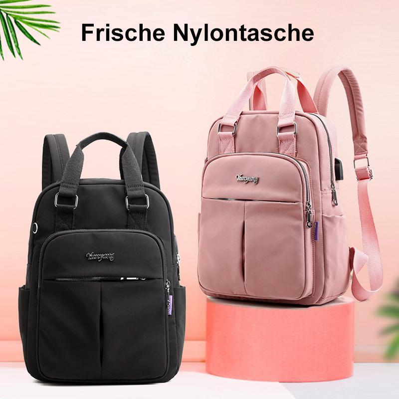 Waterdichte rugzak met USB-oplaadfunctie, grote capaciteit, zwart, voorkant; ideaal voor reizen en dagelijks gebruik.