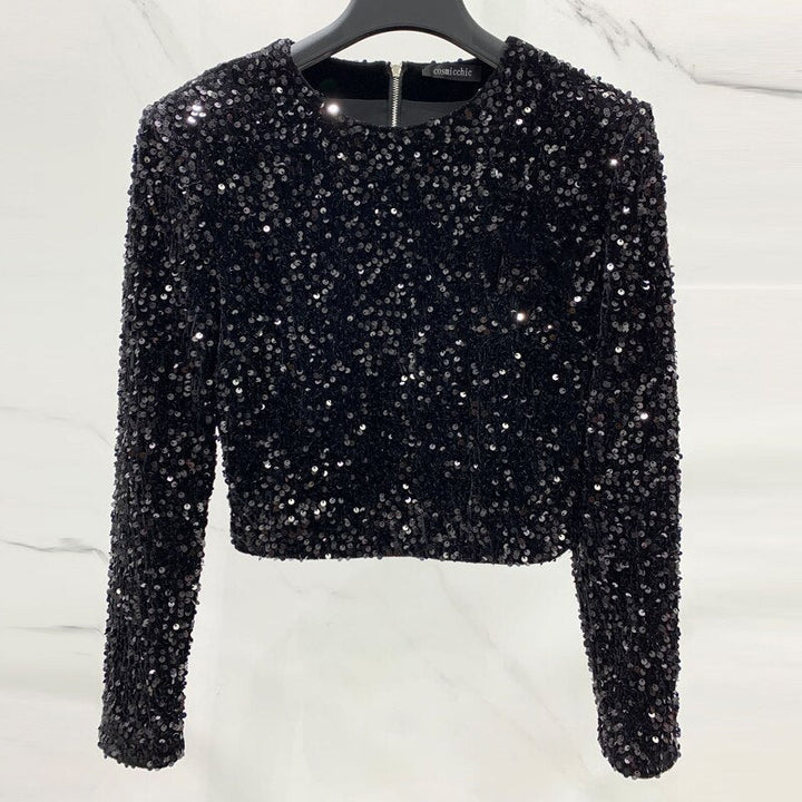 Feestelijk zwart dames topje. Stijlvolle Kaias top, perfect voor avondkleding en een chique kerst look.