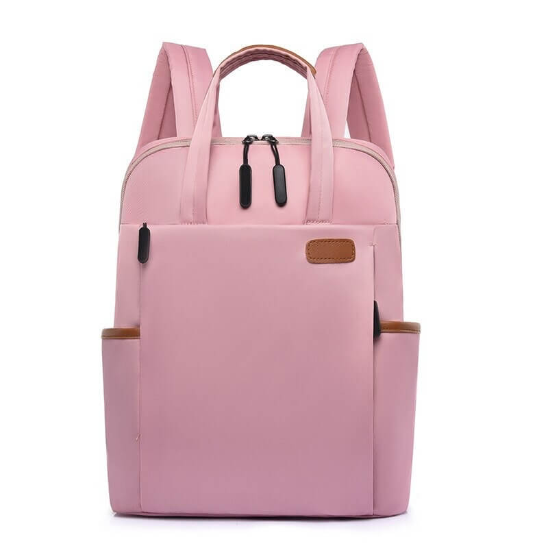 Roze antidiefstal rugzak voor vrouwen, compact en veilig voor dagelijks gebruik of reizen.