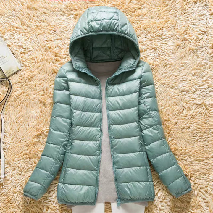 Comfortabele dames donsjas met capuchon, ultralicht en opvouwbaar, ideaal als warme casual jas of bovenkleding.